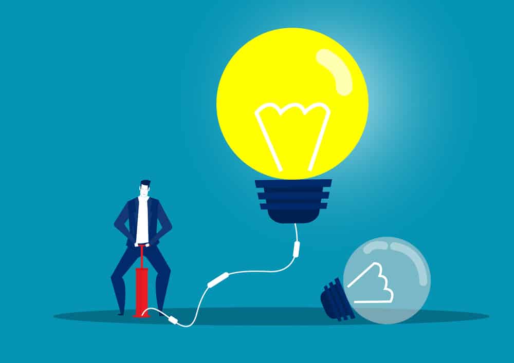Ilustracja biznesmen dmuchający żarówkę pompą powietrzną