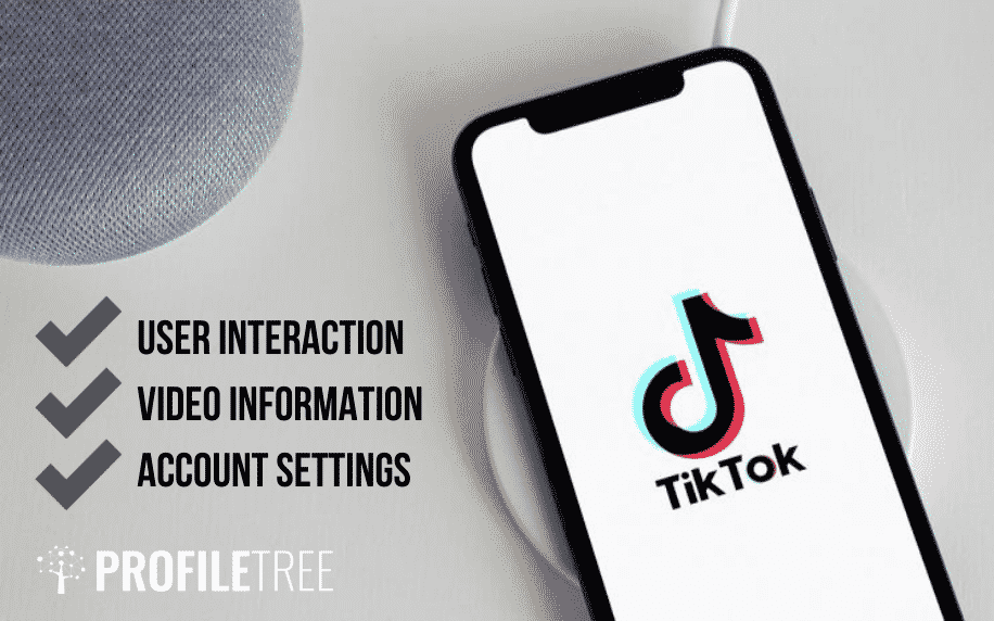 พื้นหลังสีเทากับโทรศัพท์สีดำพร้อมไอคอน tiktok บนหน้าจอ