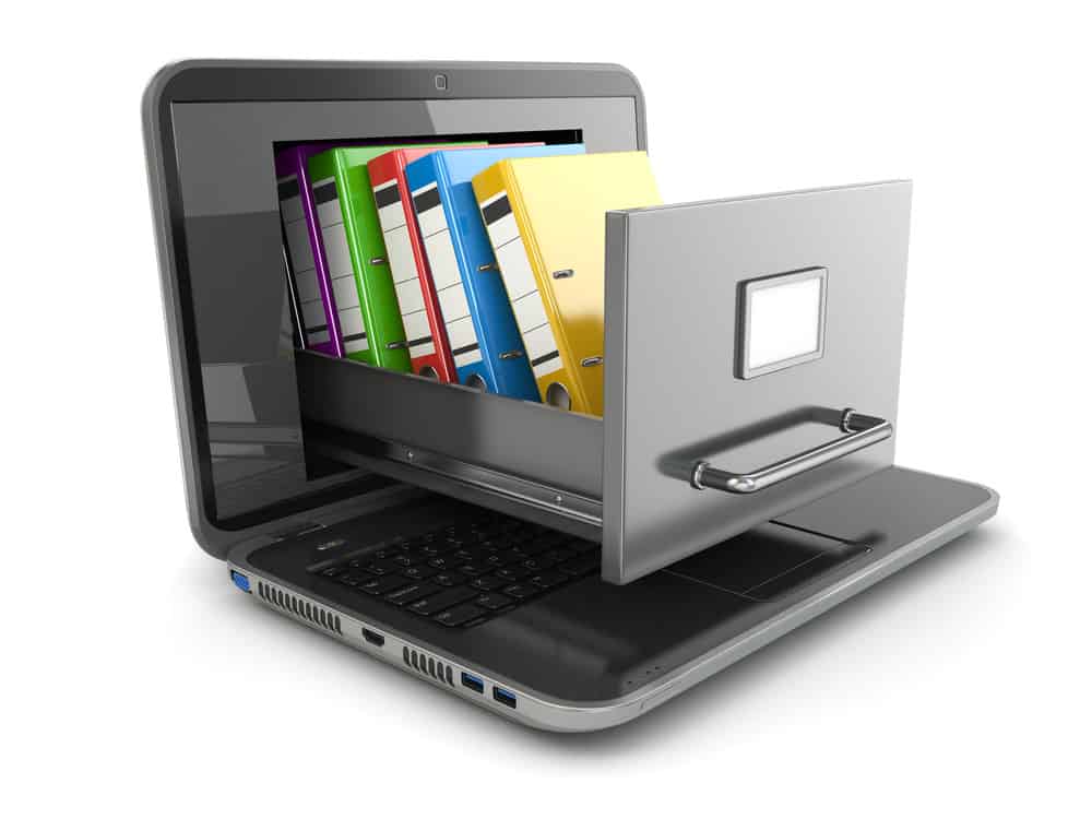 Laptop cu dulap de dosare care iese din el.