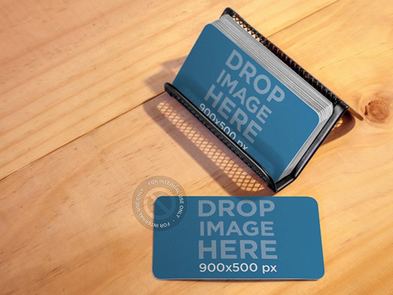 BUSINESS CARDS PLACED OVER A METAL BUSINESS CARDHOLDER MOCKUP