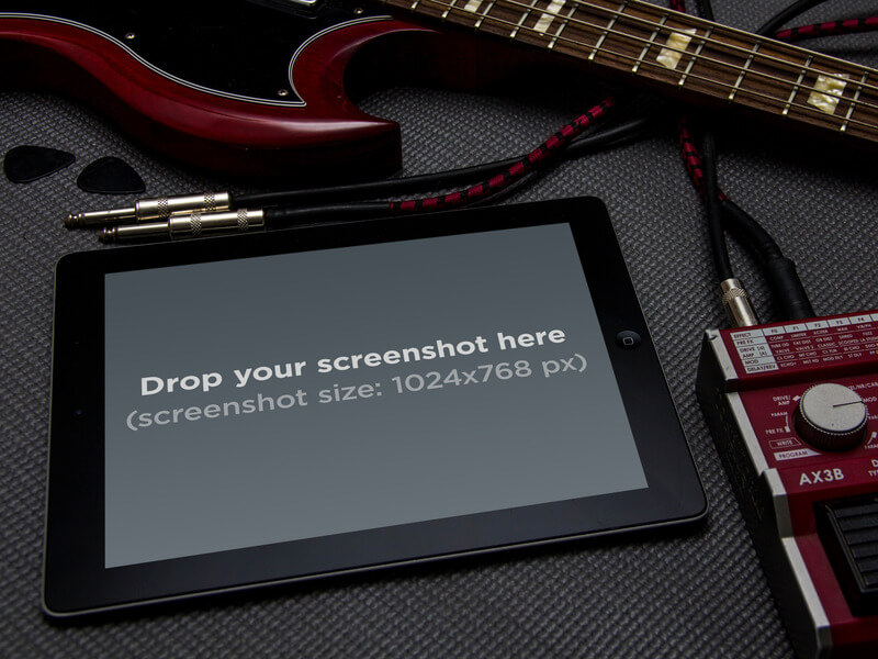 Modèle de maquette iPad à côté de la guitare électrique