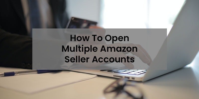 一个穿着西装的男人在他的白色笔记本电脑上工作的特写图像